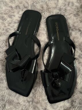 BCBGeneration Black Bow Jelly Slide Sandals